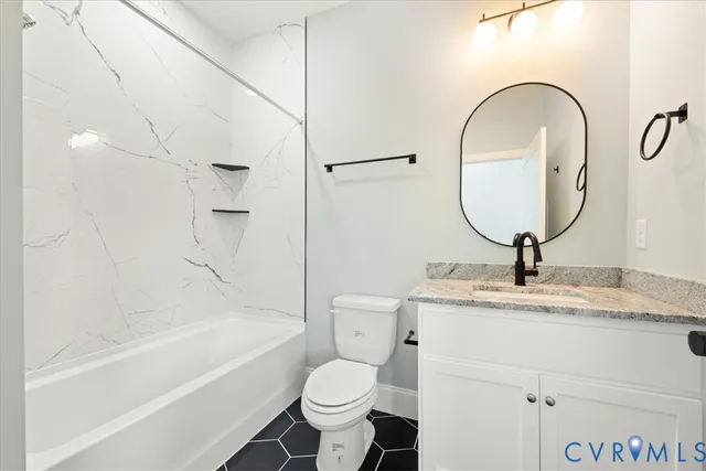 a bathroom with a sink a toilet and a bathtub