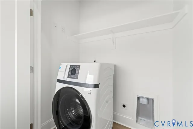 a view of a storage & utility room with dryer and washer