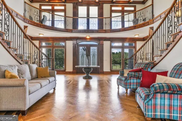 a dining room with furniture and wooden floor
