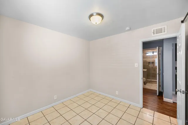 a view of an empty room and window