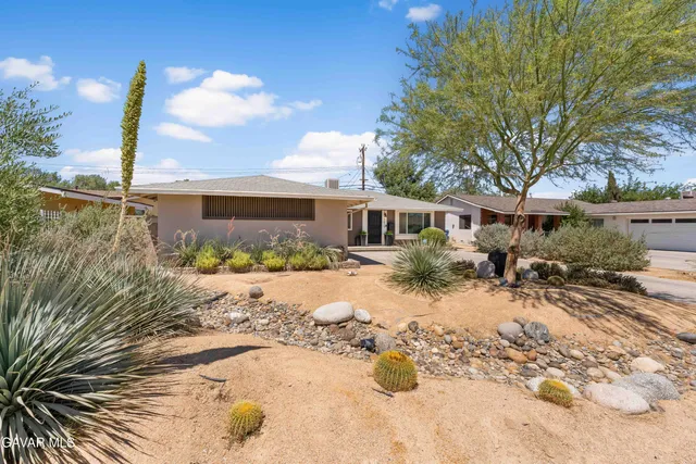 a view of a house with a snow in the yard