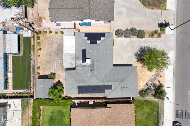 a aerial view of multiple houses with a yard