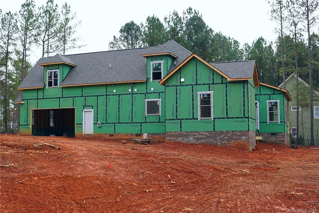314 McCrary Road Mooresville, NC 28117 - Photo 2 of 20 a view of a house with a yard and a wooden fence