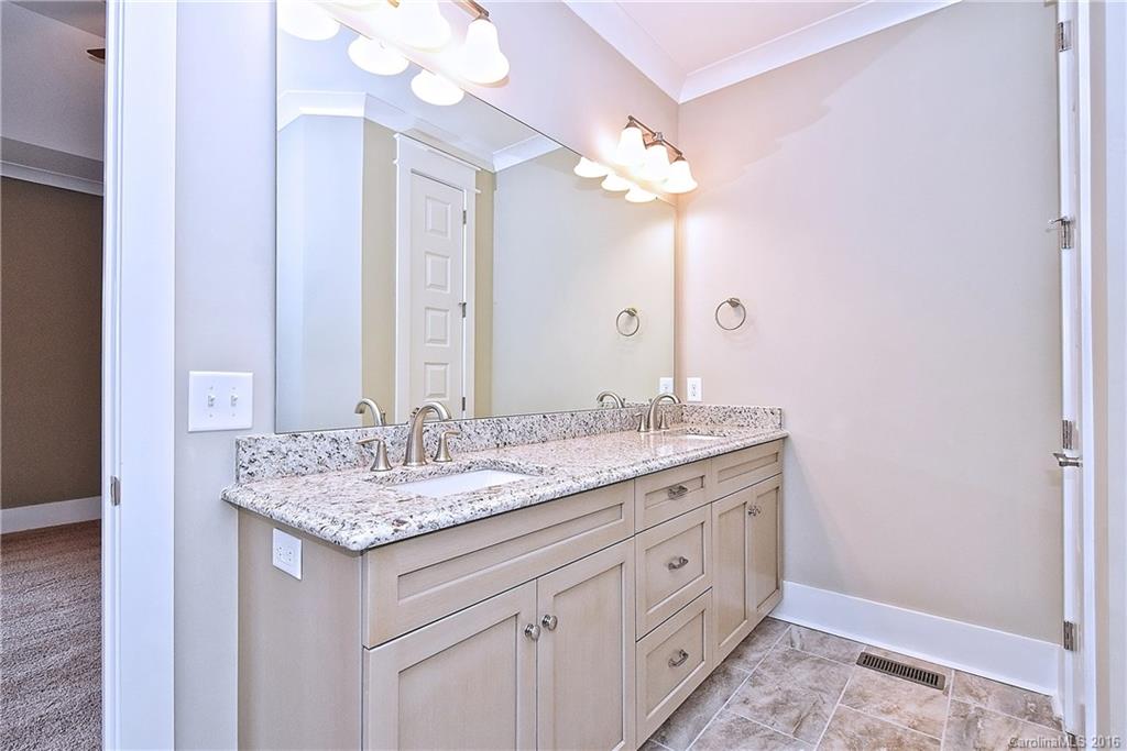 314 McCrary Road Mooresville, NC 28117 - Photo 12 of 20 a bathroom with a granite countertop double vanity sink and a mirror