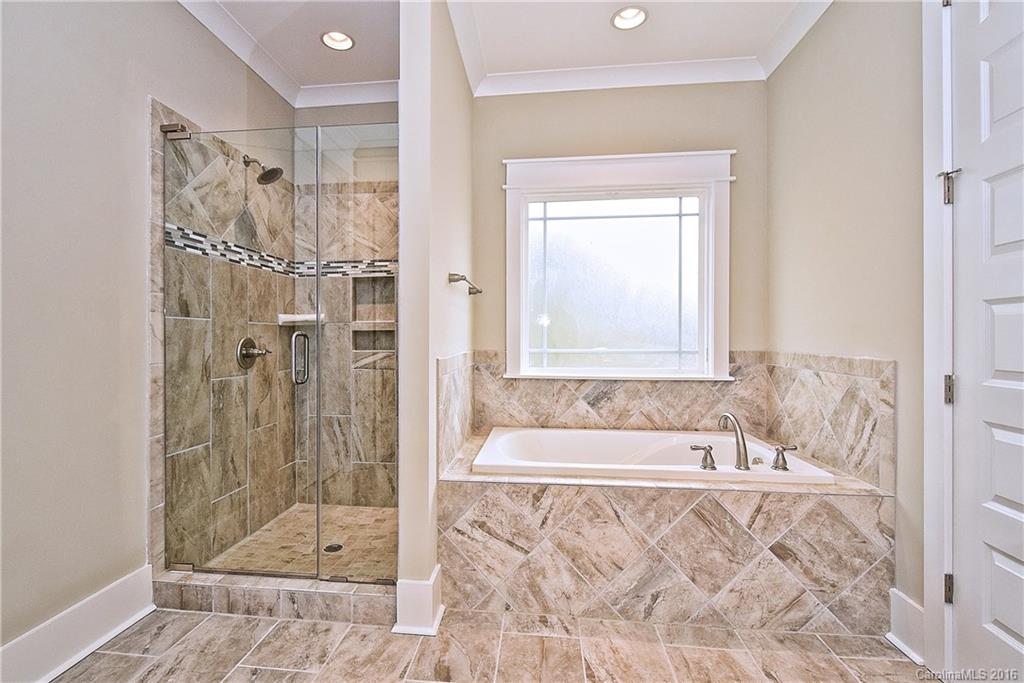 314 McCrary Road Mooresville, NC 28117 - Photo 13 of 20 a bathroom with a bathtub and shower