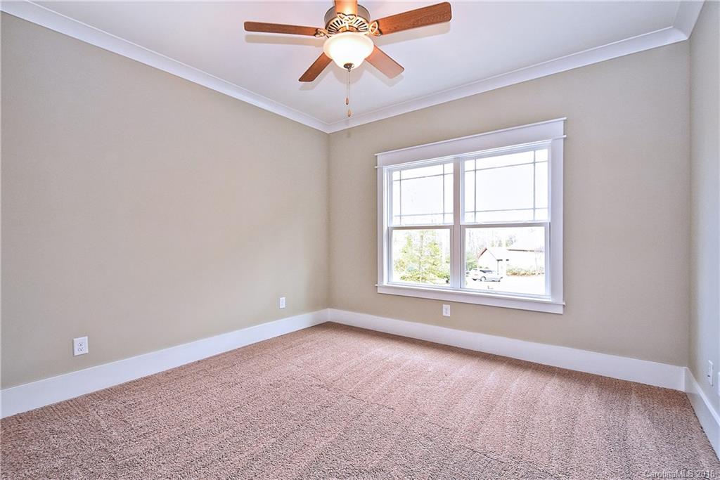 314 McCrary Road Mooresville, NC 28117 - Photo 14 of 20 an empty room with a window and a chandelier fan