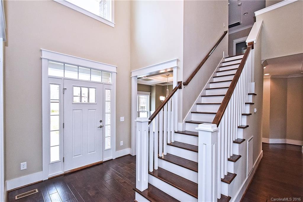 314 McCrary Road Mooresville, NC 28117 - Photo 4 of 20 a view of front door with wooden floor and stairs