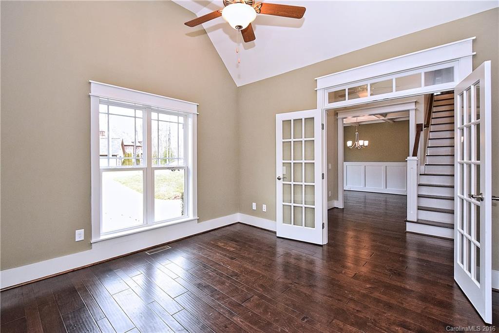 314 McCrary Road Mooresville, NC 28117 - Photo 5 of 20 an empty room with wooden floor and windows