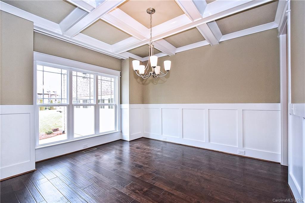 314 McCrary Road Mooresville, NC 28117 - Photo 6 of 20 a view of an empty room with wooden floor and fan