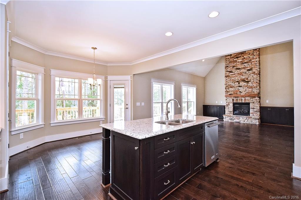 314 McCrary Road Mooresville, NC 28117 - Photo 10 of 20 a view of kitchen and hall with wooden floor