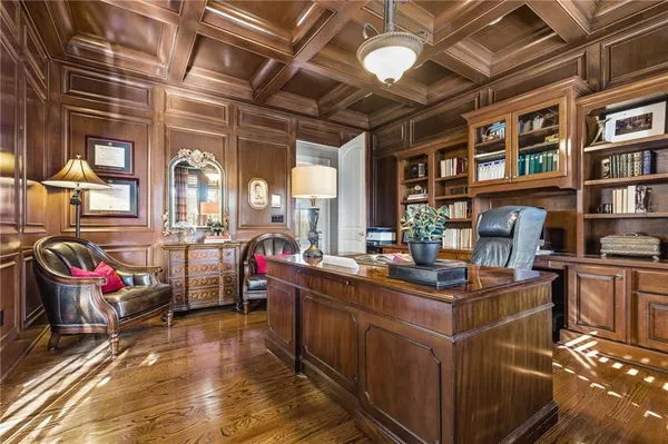 a living room with a bed furniture and a large window