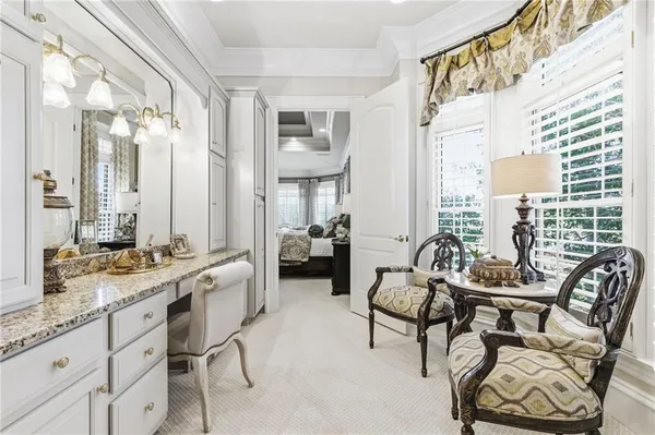 a bedroom with a bed and a table