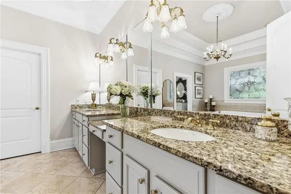 a bathroom with a sink a vanity and a mirror