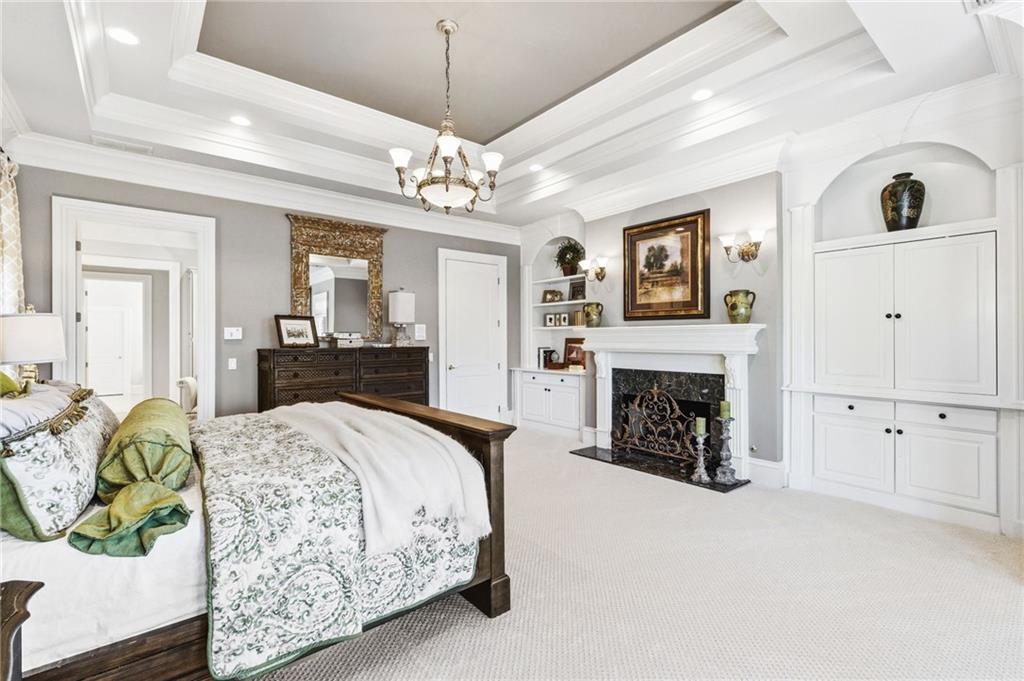 1400 Paul Aiken Road Dallas, GA 30157 - Photo 28 of 62 a spacious bedroom with a bed and a fireplace