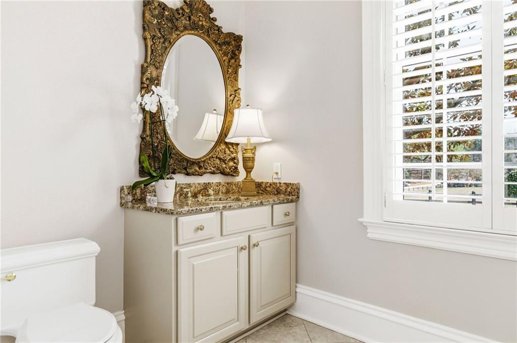 1400 Paul Aiken Road Dallas, GA 30157 - Photo 35 of 62 a bathroom with a sink a toilet and a mirror