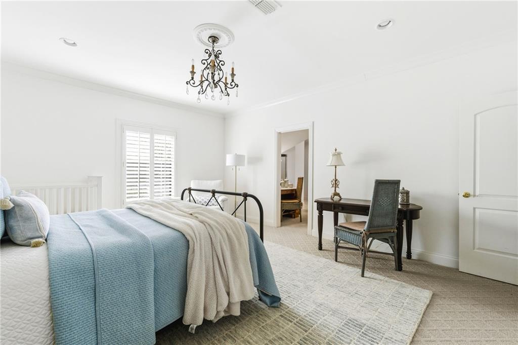 1400 Paul Aiken Road Dallas, GA 30157 - Photo 40 of 62 a bedroom with a bed and a chandelier