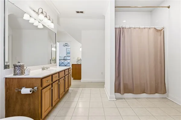 a dining room with furniture and a chandelier