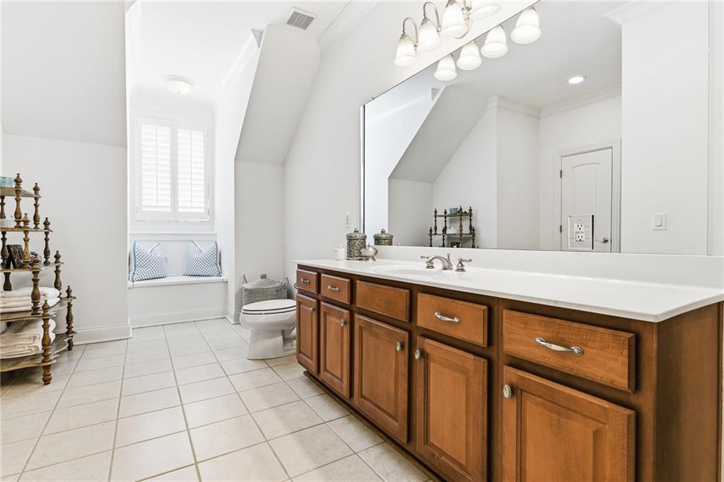 1400 Paul Aiken Road Dallas, GA 30157 - Photo 42 of 62 a bathroom with a double vanity sink a toilet and a mirror