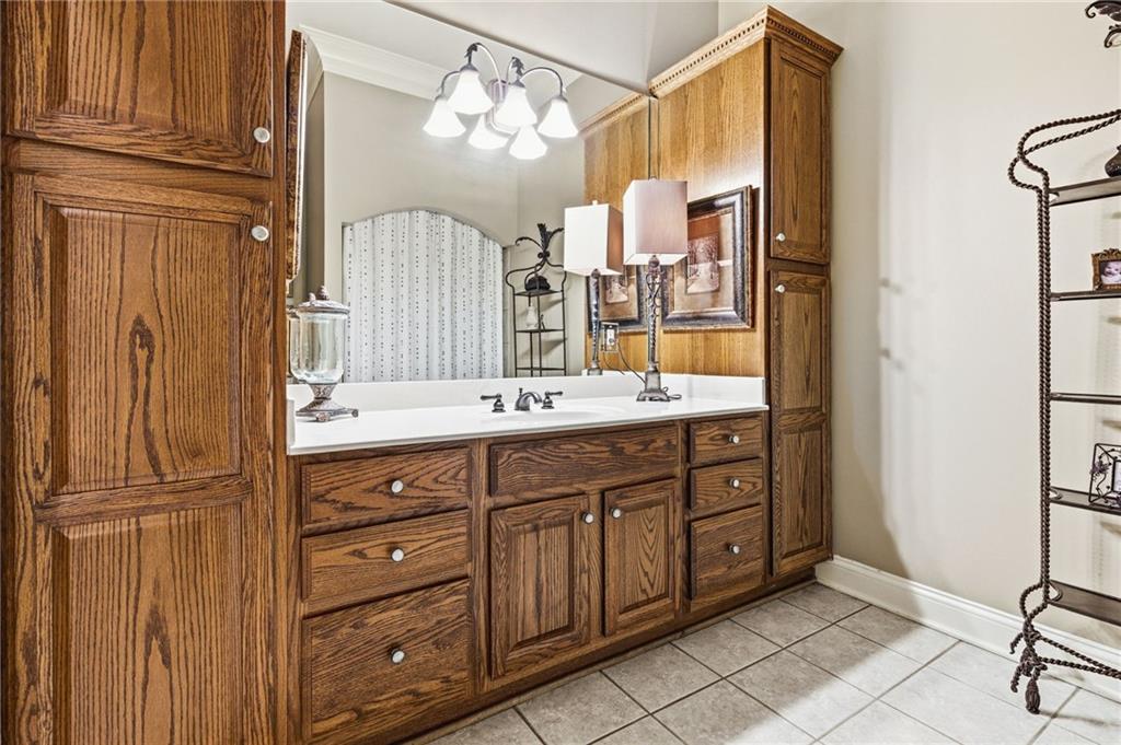 1400 Paul Aiken Road Dallas, GA 30157 - Photo 57 of 62 a bathroom with a double vanity sink a mirror and a shower