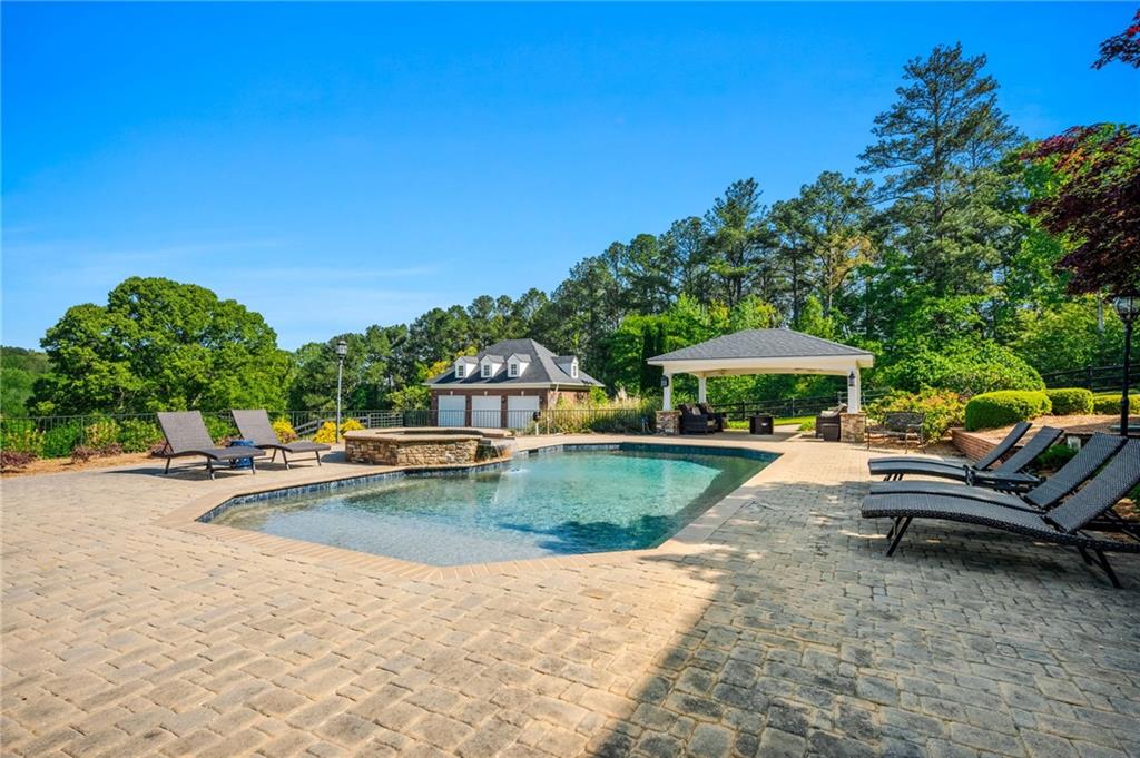1400 Paul Aiken Road Dallas, GA 30157 - Photo 8 of 62 a view of a swimming pool with lounge chairs in patio