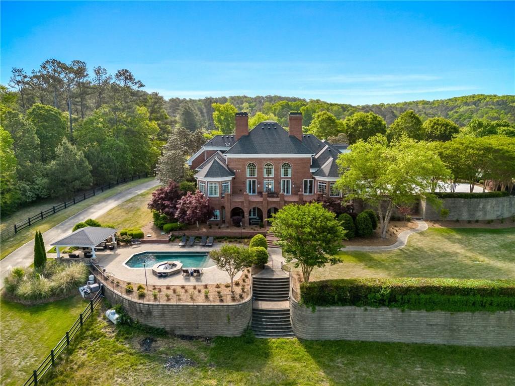 1400 Paul Aiken Road Dallas, GA 30157 - Photo 9 of 62 a view of a swimming pool with a garden