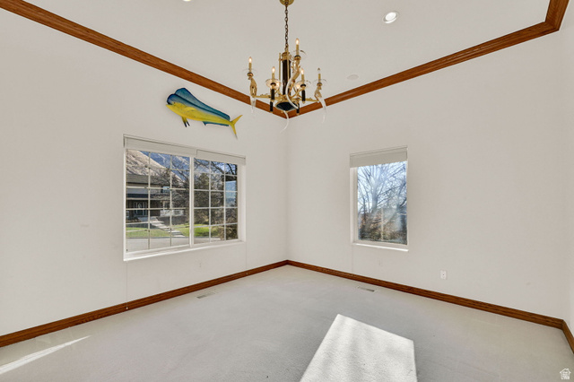 1085 Windsor Drive Provo, UT 84604 - Photo 23 of 83 Unfurnished room with ornamental molding, a chandelier, carpet, plenty of natural light, and recessed lighting