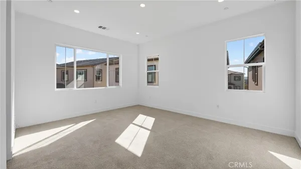 a view of empty room with windows