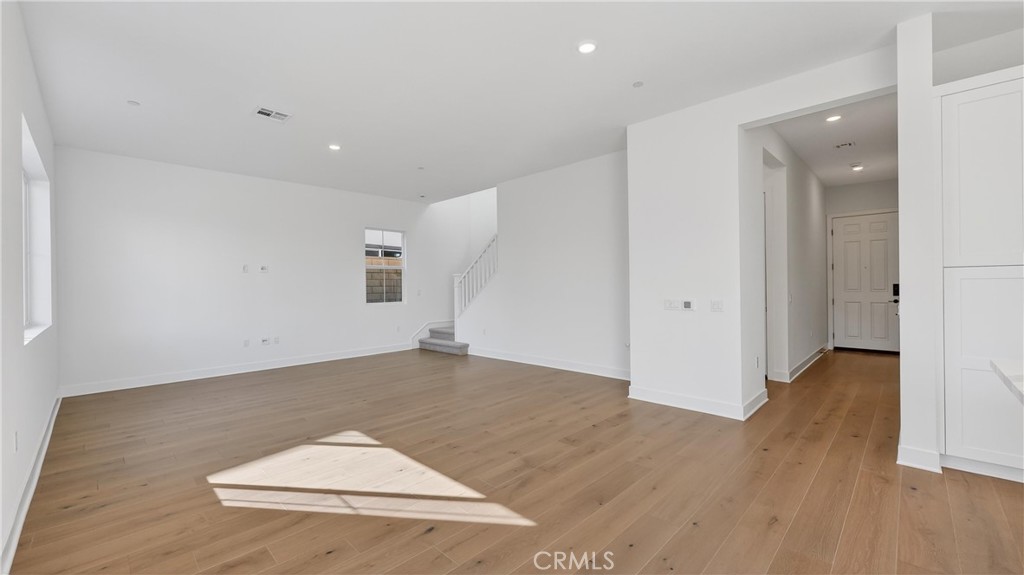 107 Pansy Irvine, CA 92618 - Photo 7 of 35 an empty room with wooden floor