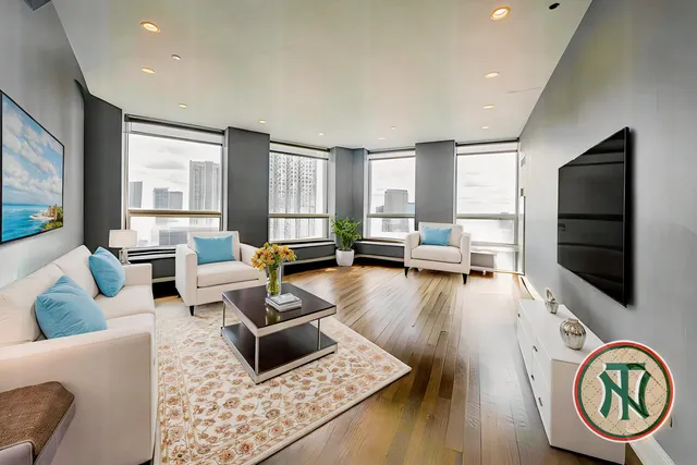 a living room with furniture and a flat screen tv