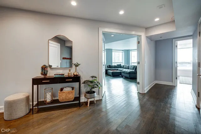 a view of living room with furniture and wooden floor