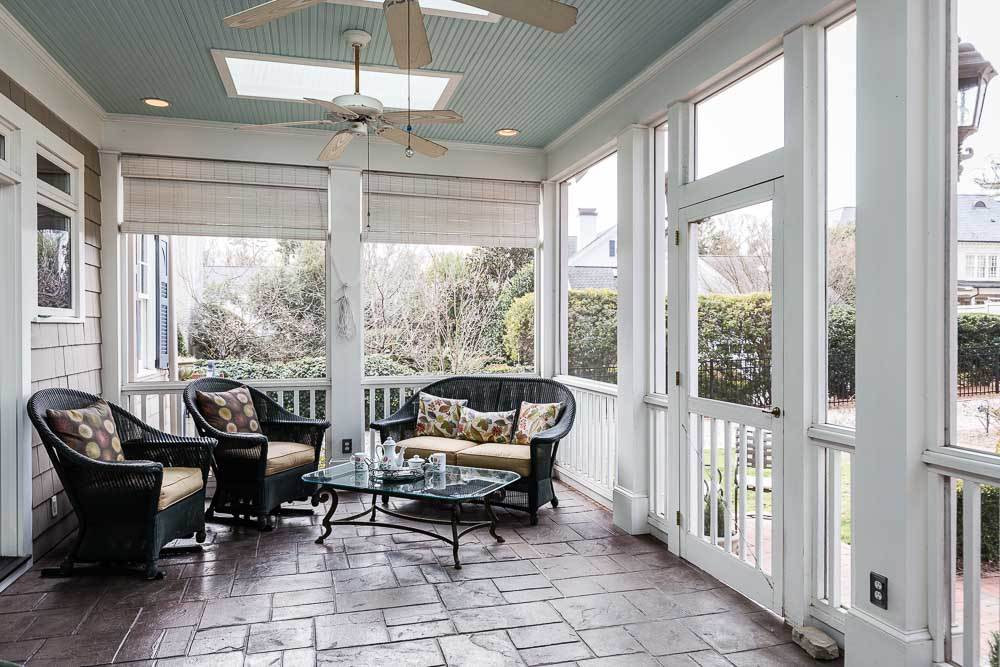 1913 Reid Street Raleigh, NC 27608 - Photo 15 of 30 a living room with furniture and a floor to ceiling window