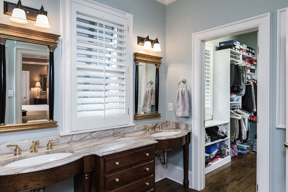 1913 Reid Street Raleigh, NC 27608 - Photo 19 of 30 a bathroom with a double vanity sink and a mirror