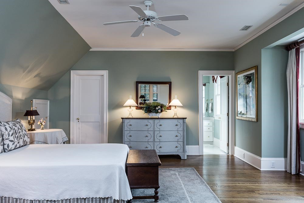1913 Reid Street Raleigh, NC 27608 - Photo 24 of 30 a bedroom with a bed and a dresser
