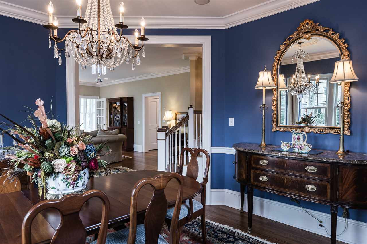 1913 Reid Street Raleigh, NC 27608 - Photo 8 of 30 a view of a dining room with furniture and chandelier