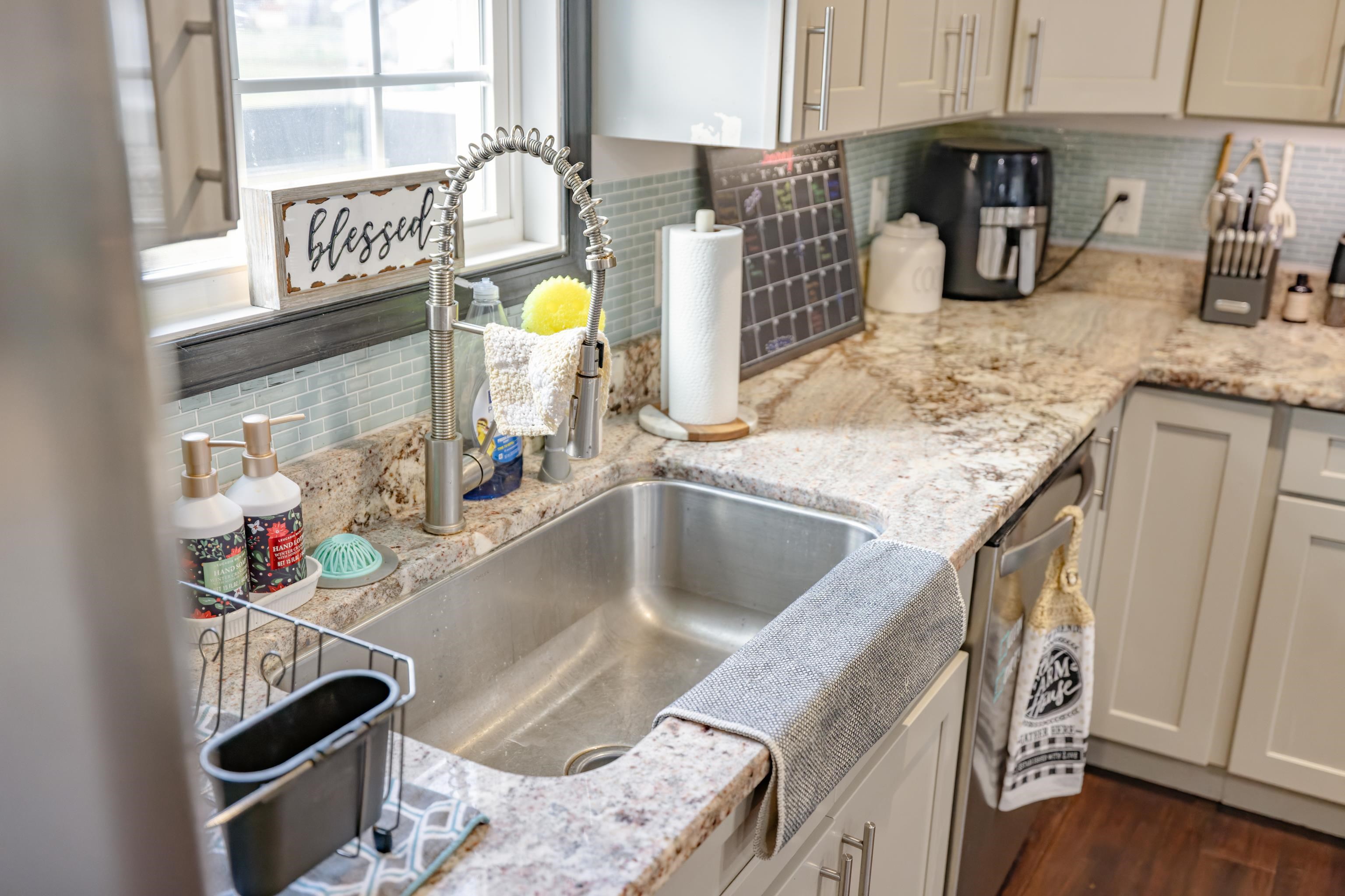 703 14th Street Grottoes, VA 24441 - Photo 12 of 51 a kitchen with a sink stove and cabinets