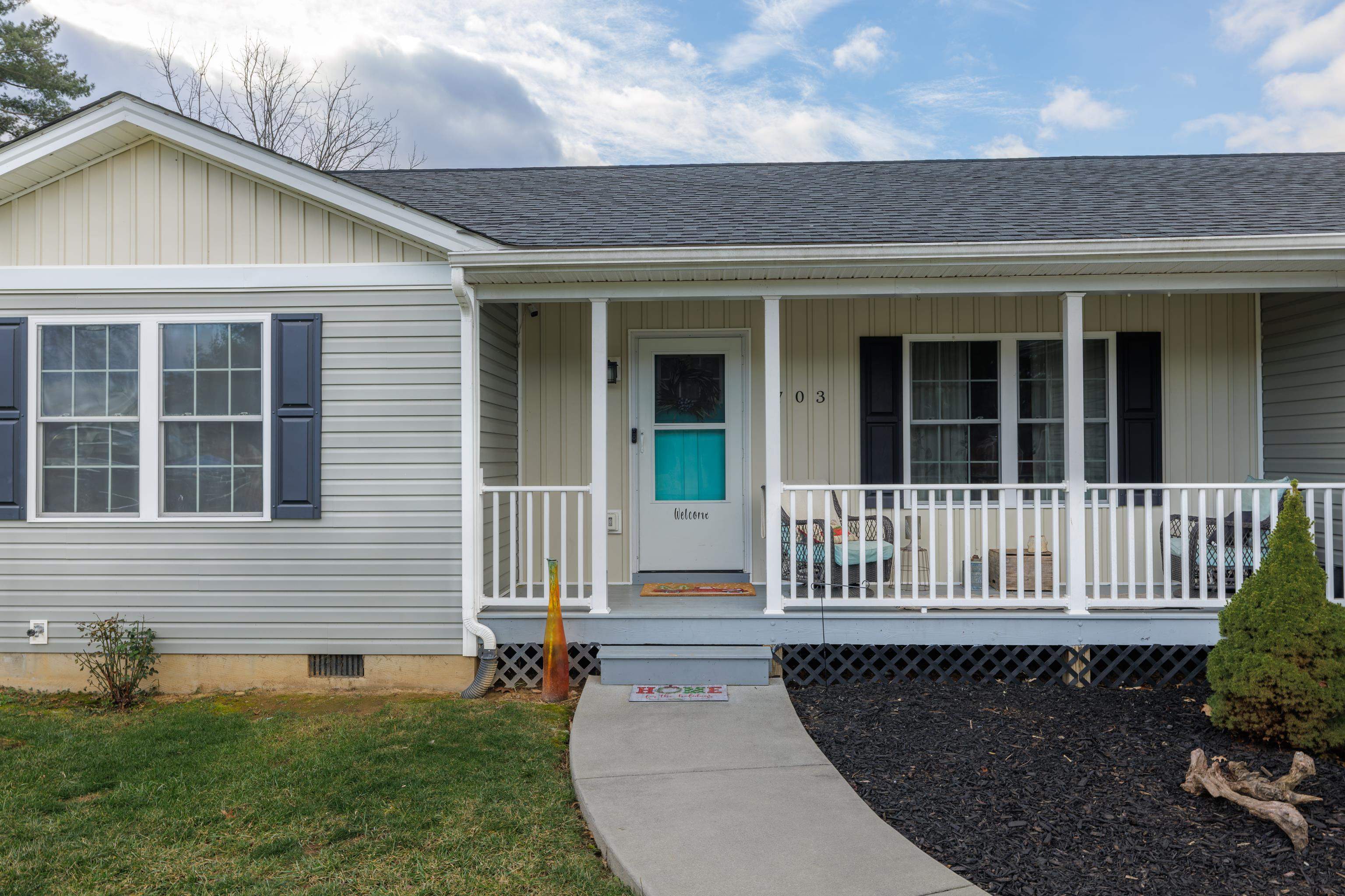 703 14th Street Grottoes, VA 24441 - Photo 2 of 51 a view of a house with a small deck and a garden
