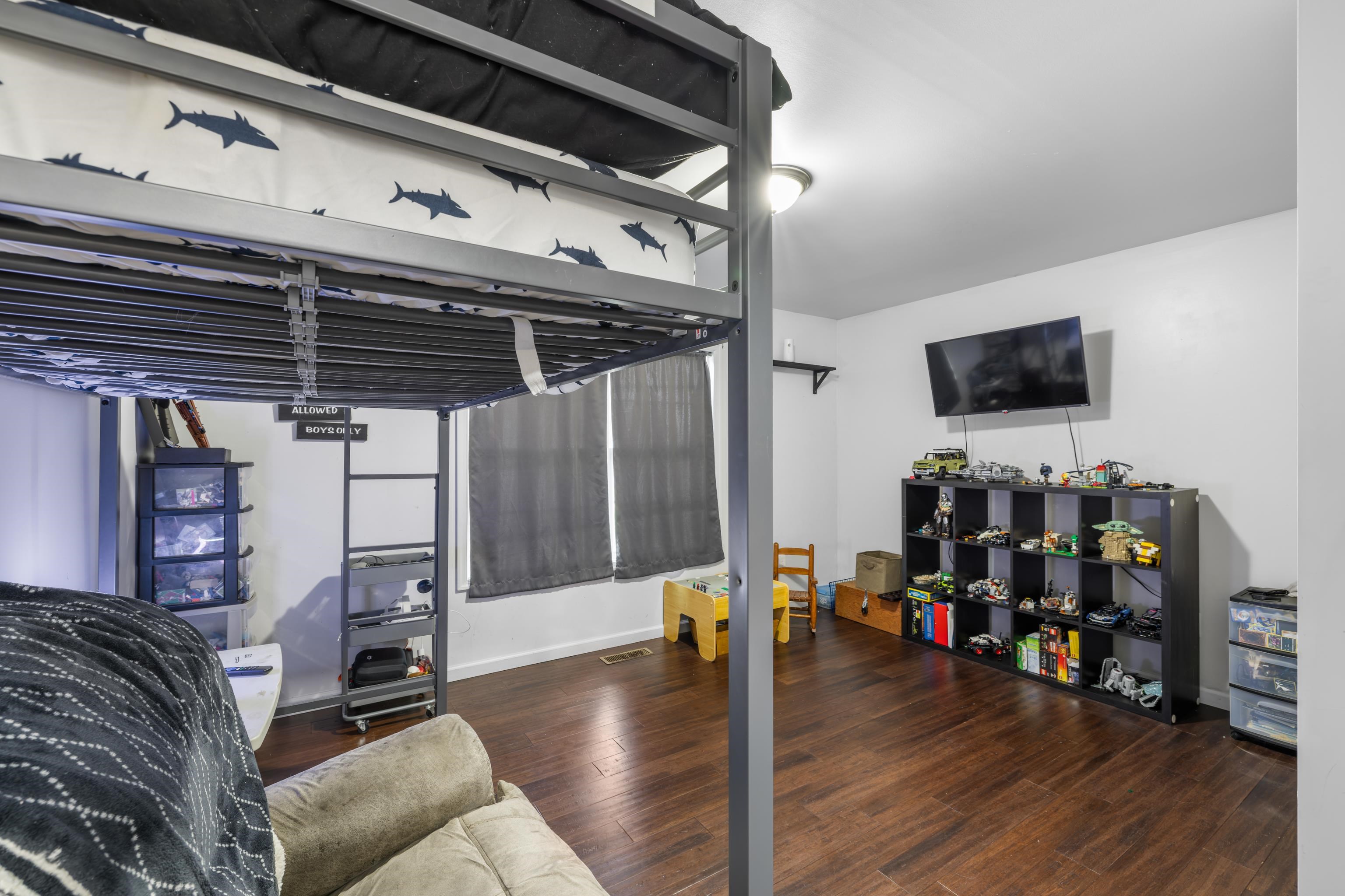 703 14th Street Grottoes, VA 24441 - Photo 23 of 51 a water heater room with wooden floor