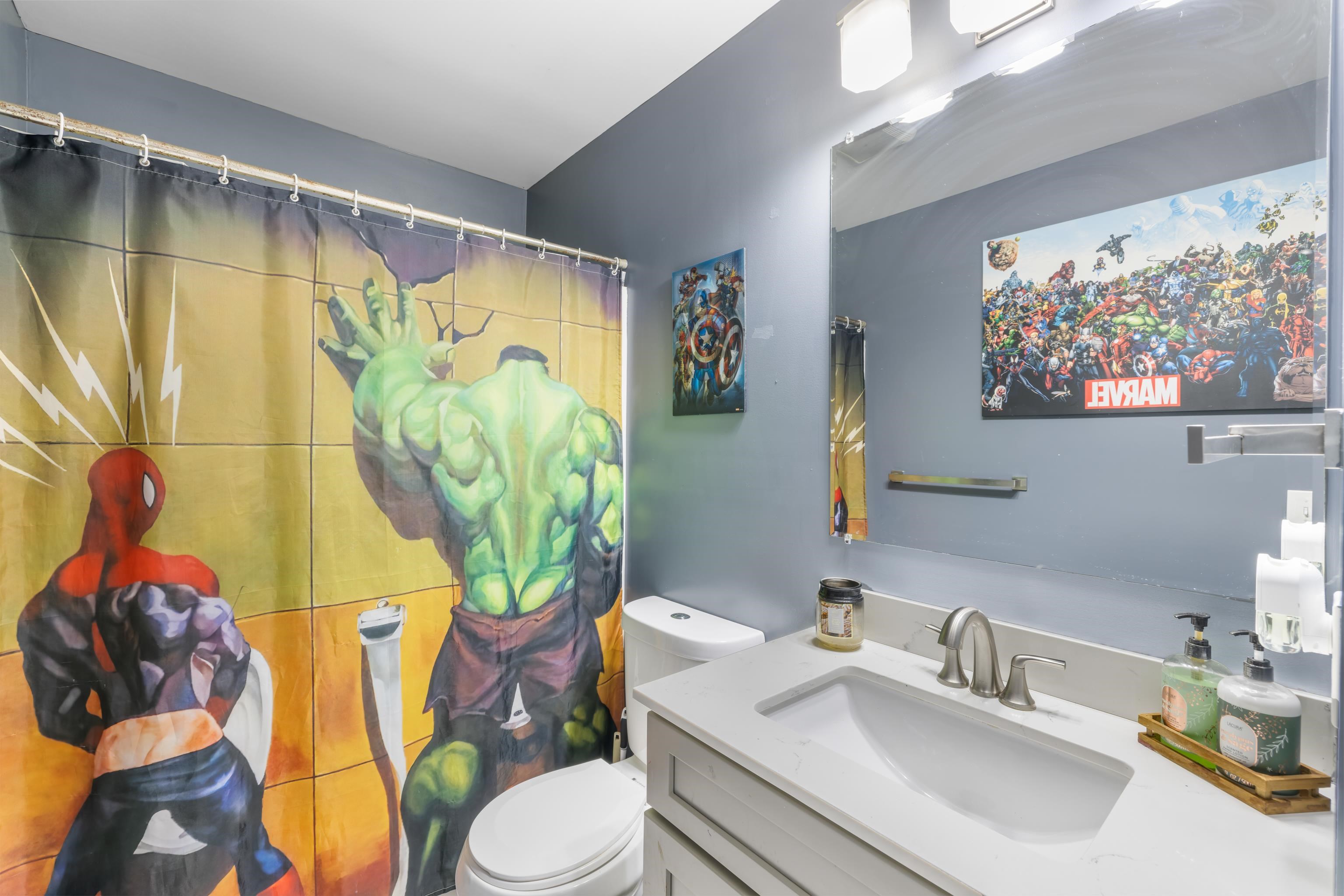 703 14th Street Grottoes, VA 24441 - Photo 25 of 51 a bathroom with a sink mirror and toilet