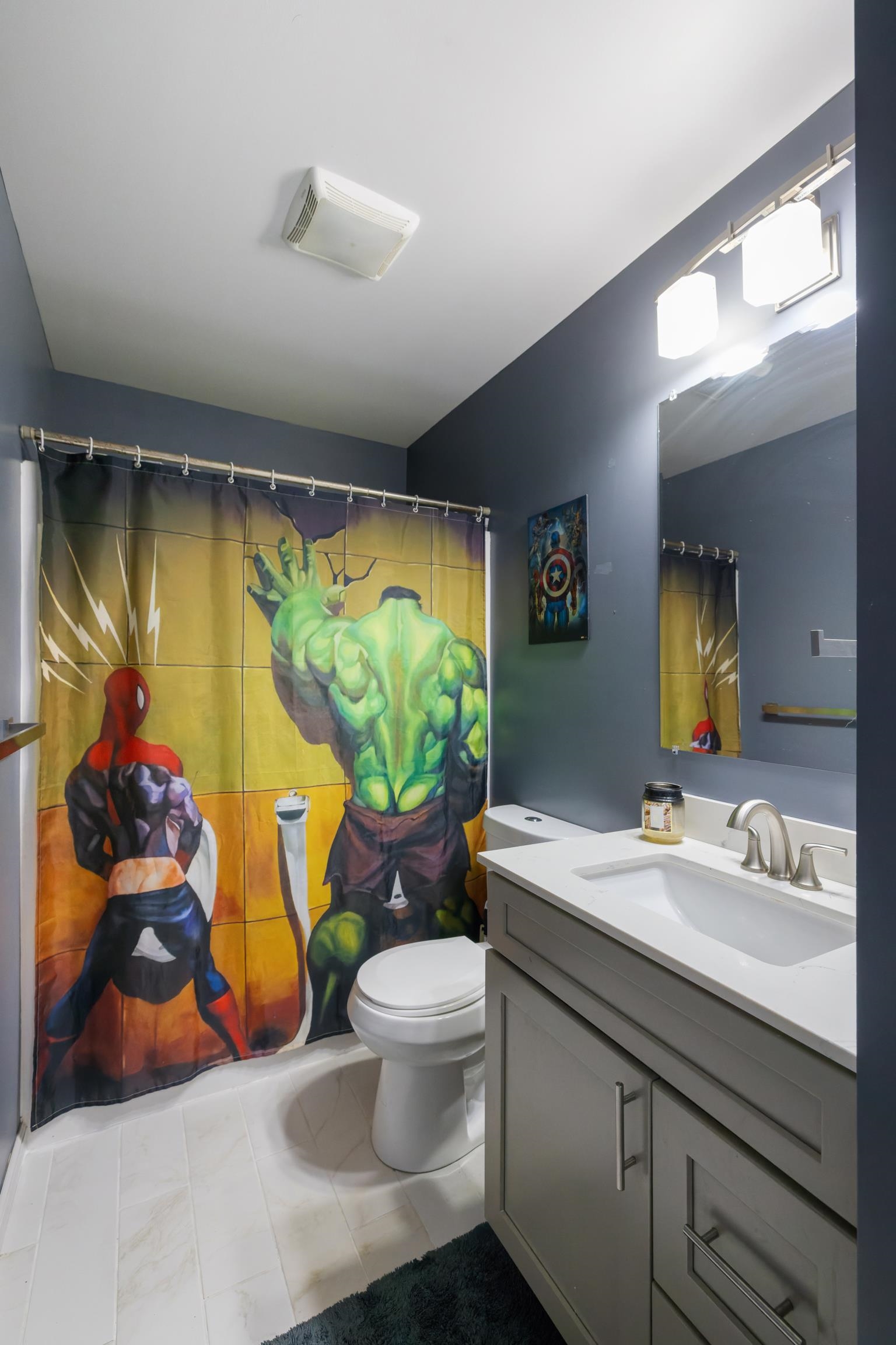 703 14th Street Grottoes, VA 24441 - Photo 26 of 51 a bathroom with a sink mirror and toilet