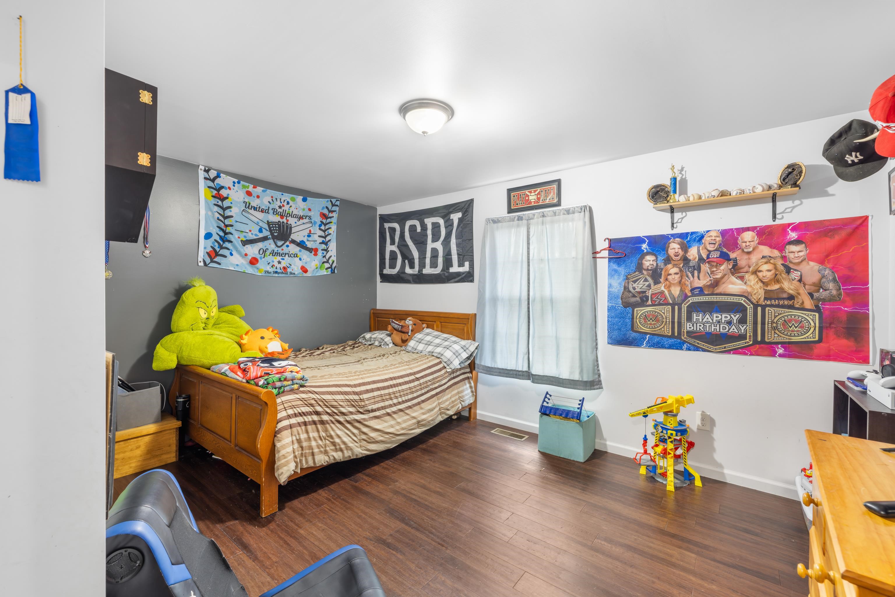 703 14th Street Grottoes, VA 24441 - Photo 29 of 51 a bedroom with a bed and wooden floor