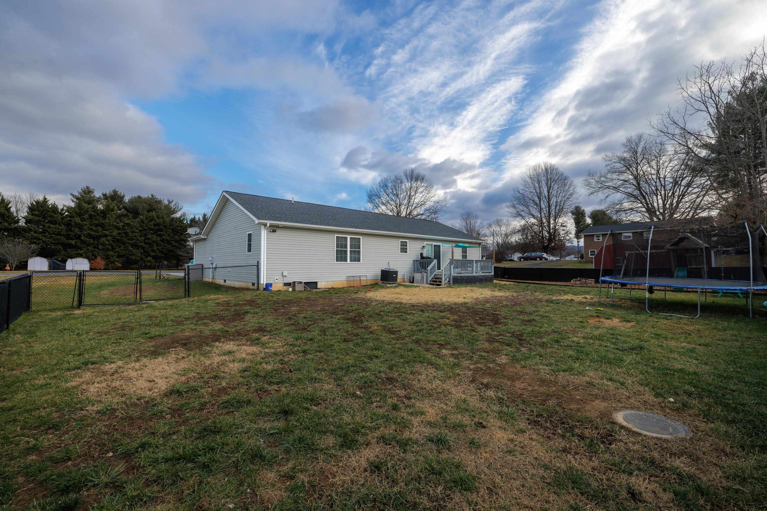 703 14th Street Grottoes, VA 24441 - Photo 33 of 51 a front view of house with yard and trees