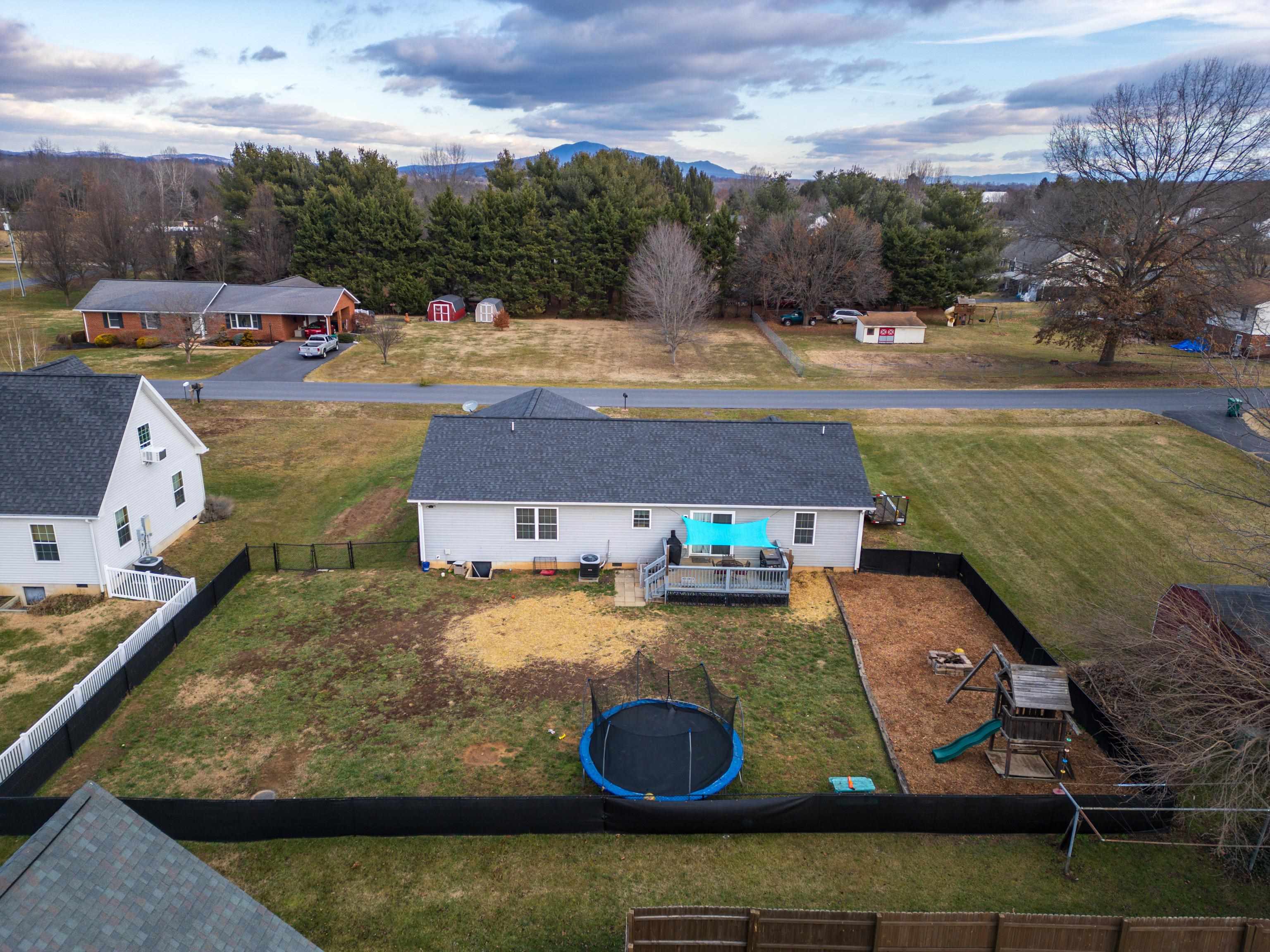 703 14th Street Grottoes, VA 24441 - Photo 42 of 51 an aerial view of a house with yard swimming pool and ocean