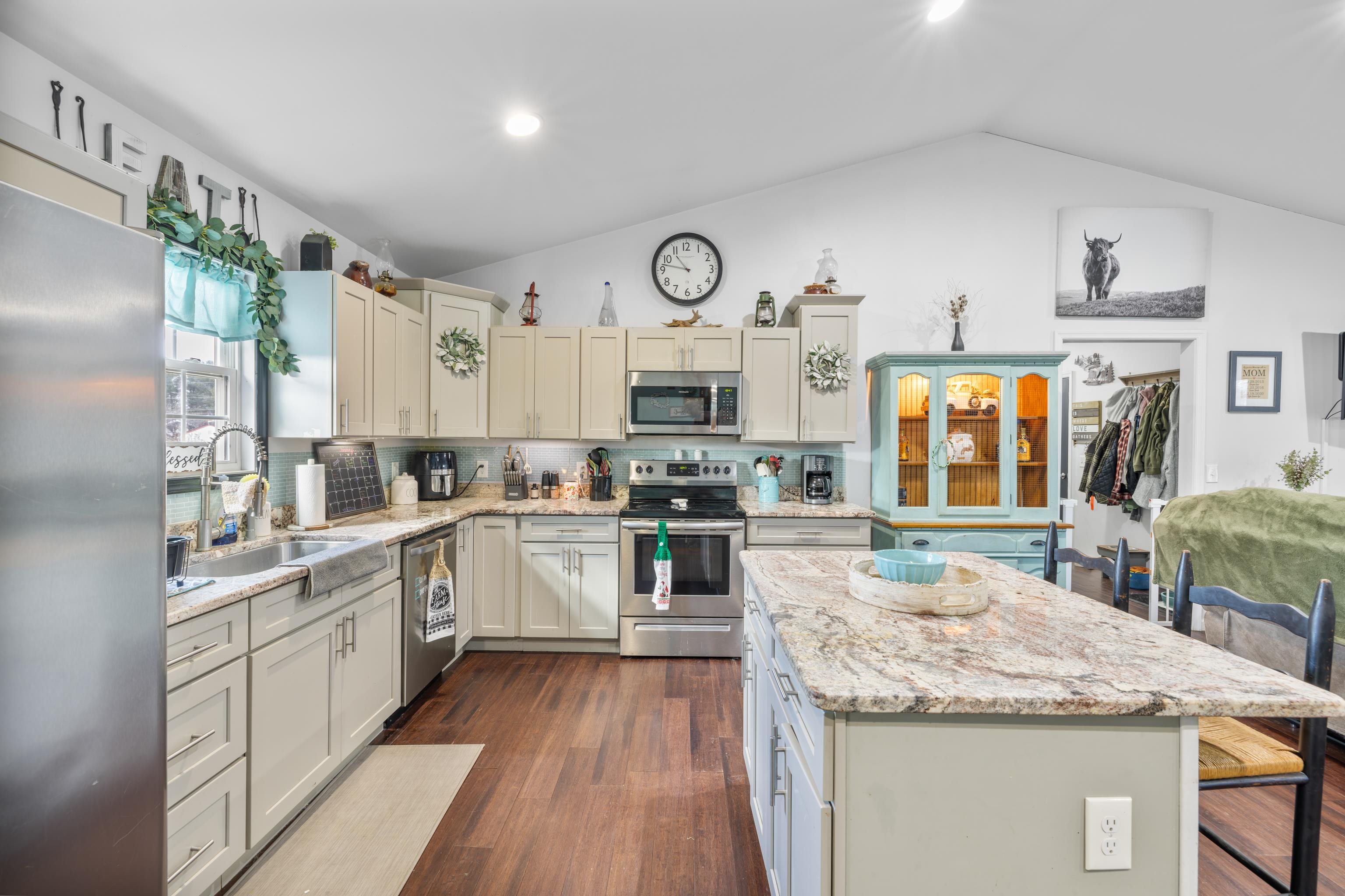 703 14th Street Grottoes, VA 24441 - Photo 10 of 51 a kitchen with granite countertop stainless steel appliances and wooden cabinets