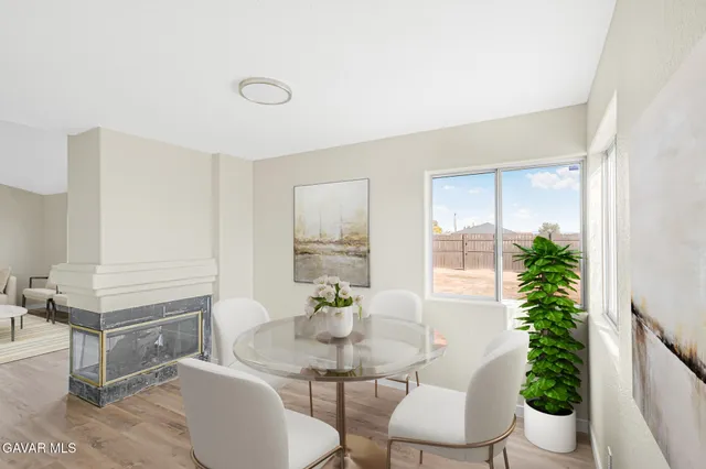 a living room with furniture potted plant and a window