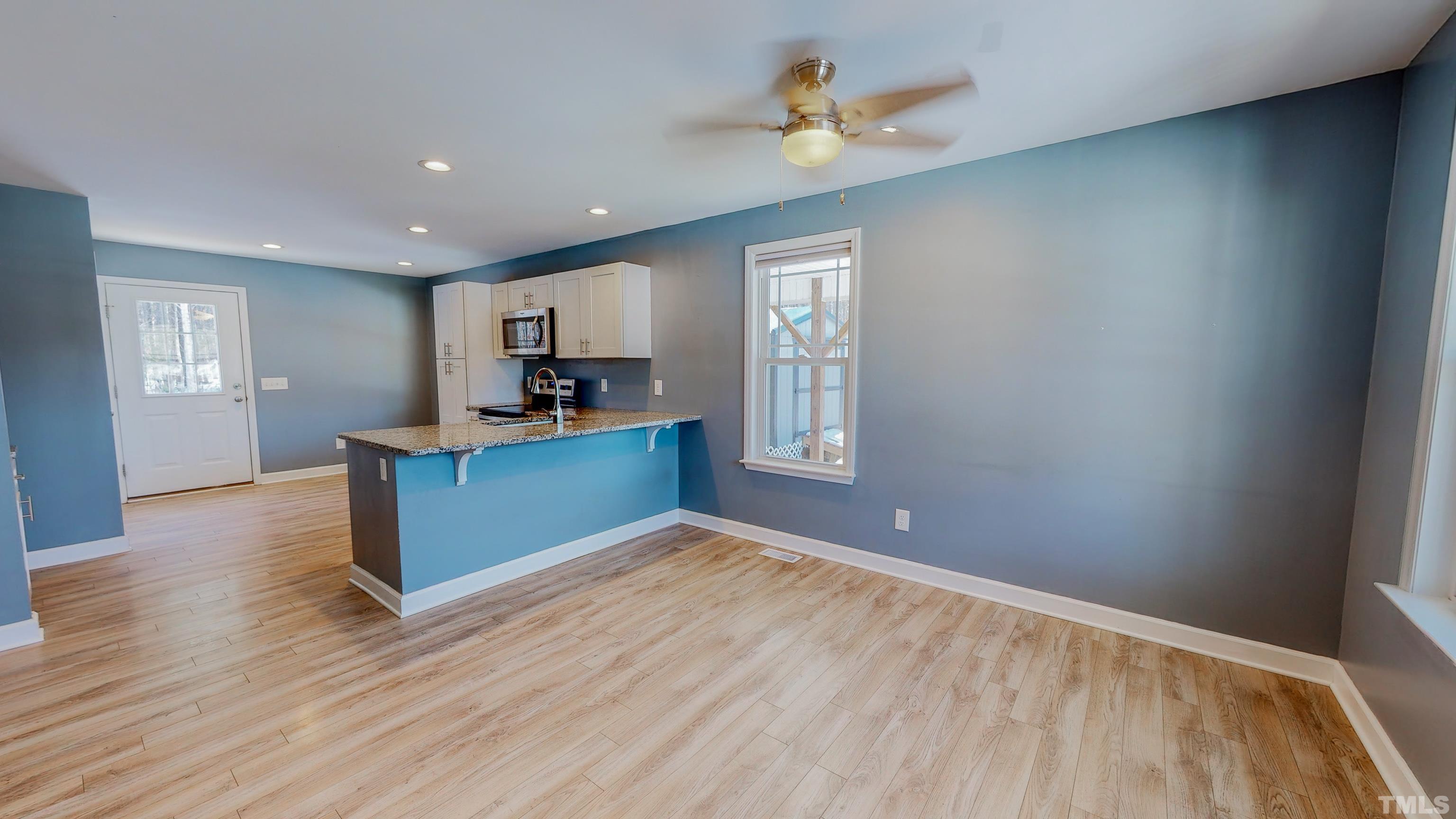45 Eli Court Roxboro, NC 27573 - Photo 2 of 36 a view of a kitchen with wooden floor and a kitchen