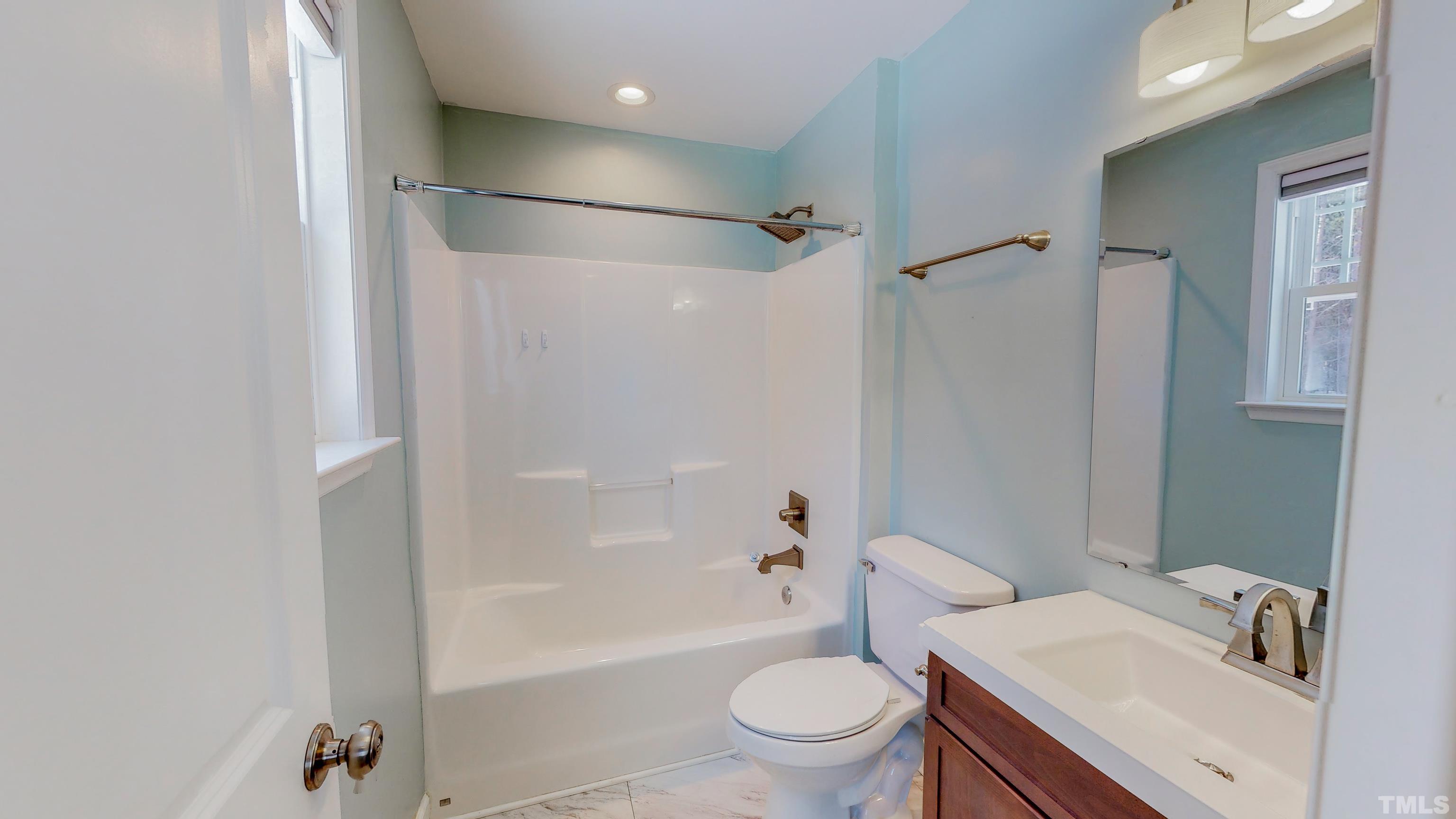 45 Eli Court Roxboro, NC 27573 - Photo 16 of 36 a bathroom with a sink toilet and shower