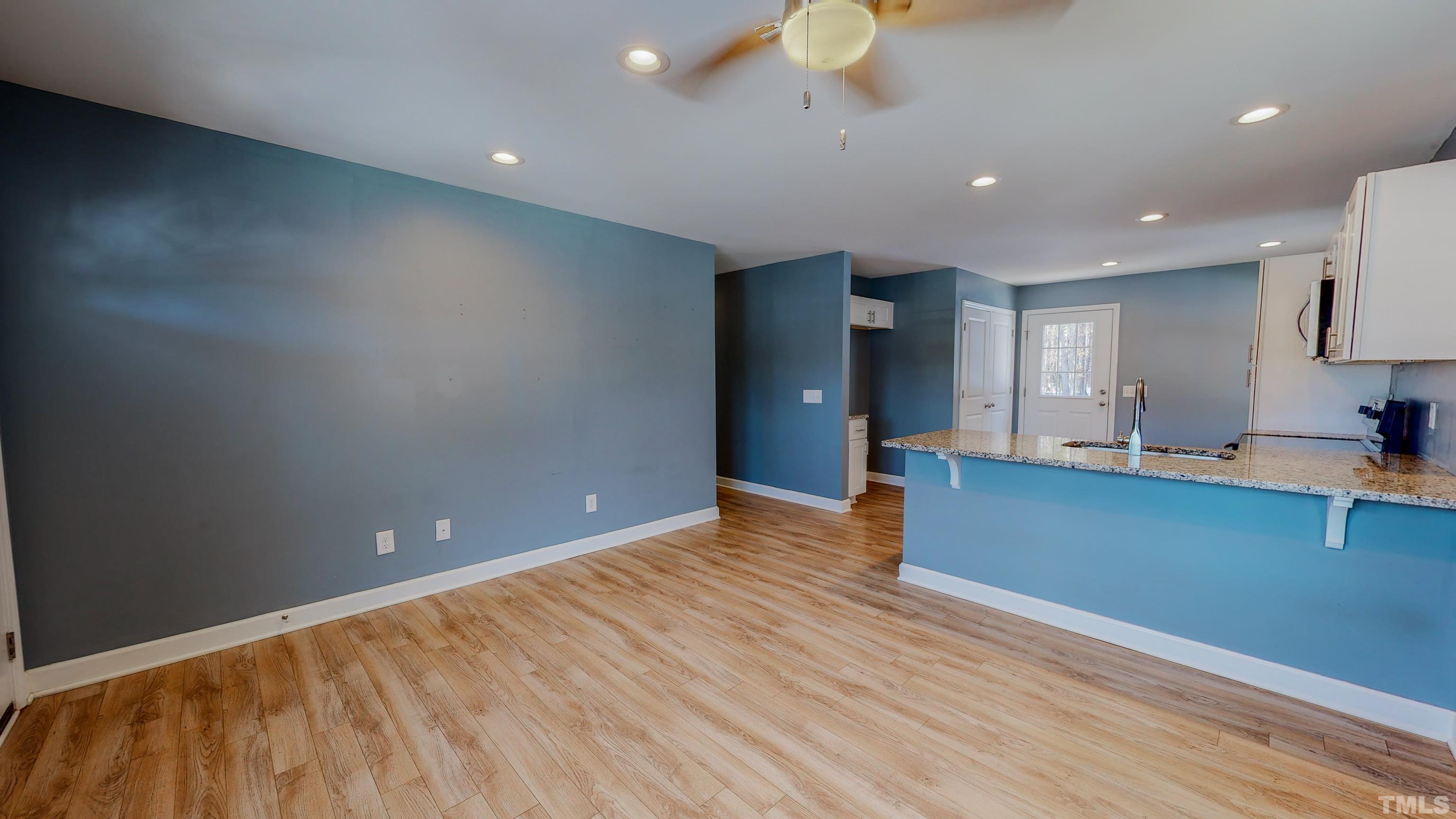 45 Eli Court Roxboro, NC 27573 - Photo 17 of 36 a view of kitchen and wooden floor