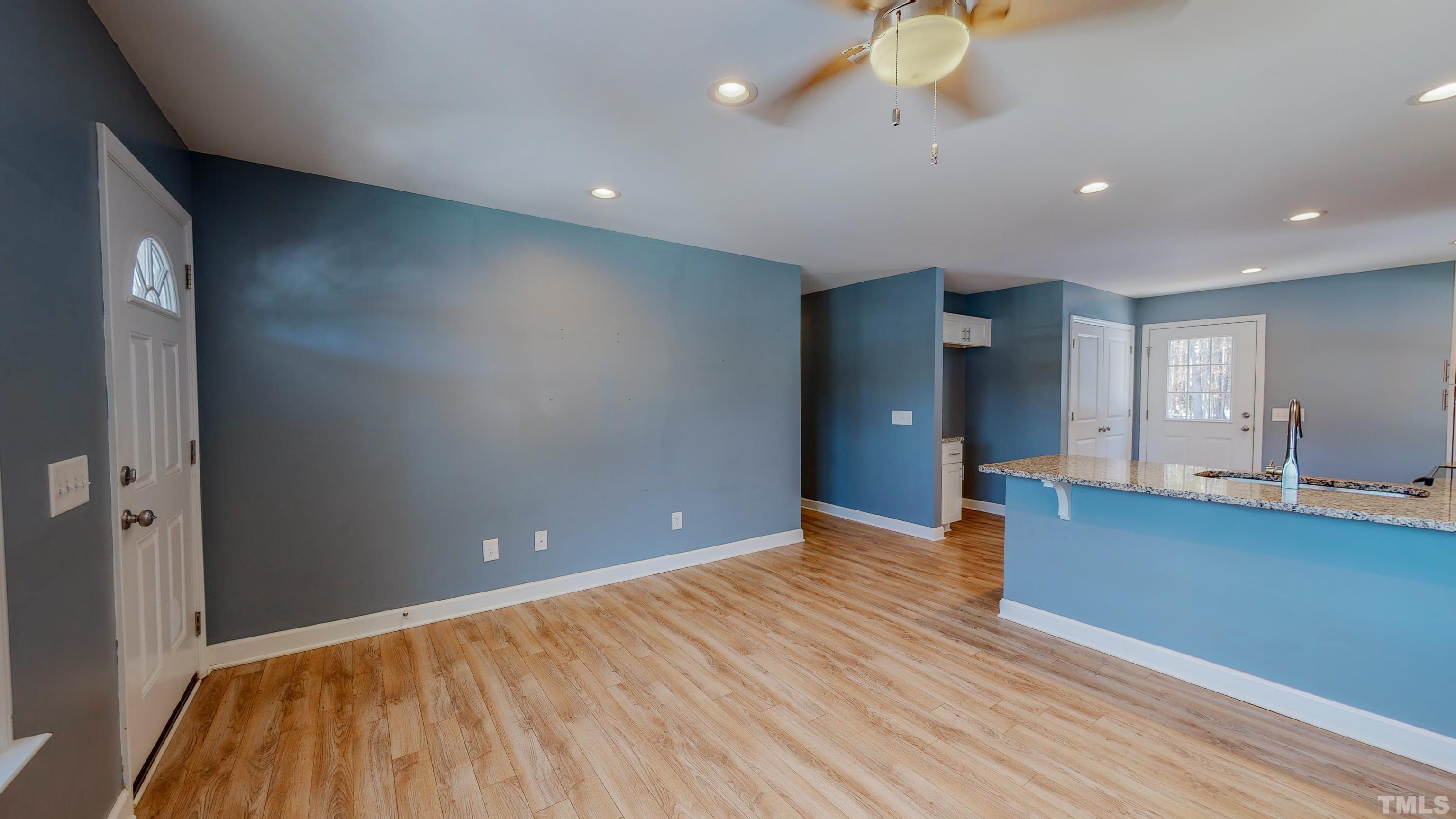 45 Eli Court Roxboro, NC 27573 - Photo 18 of 36 a view of an empty room with wooden floor and a window