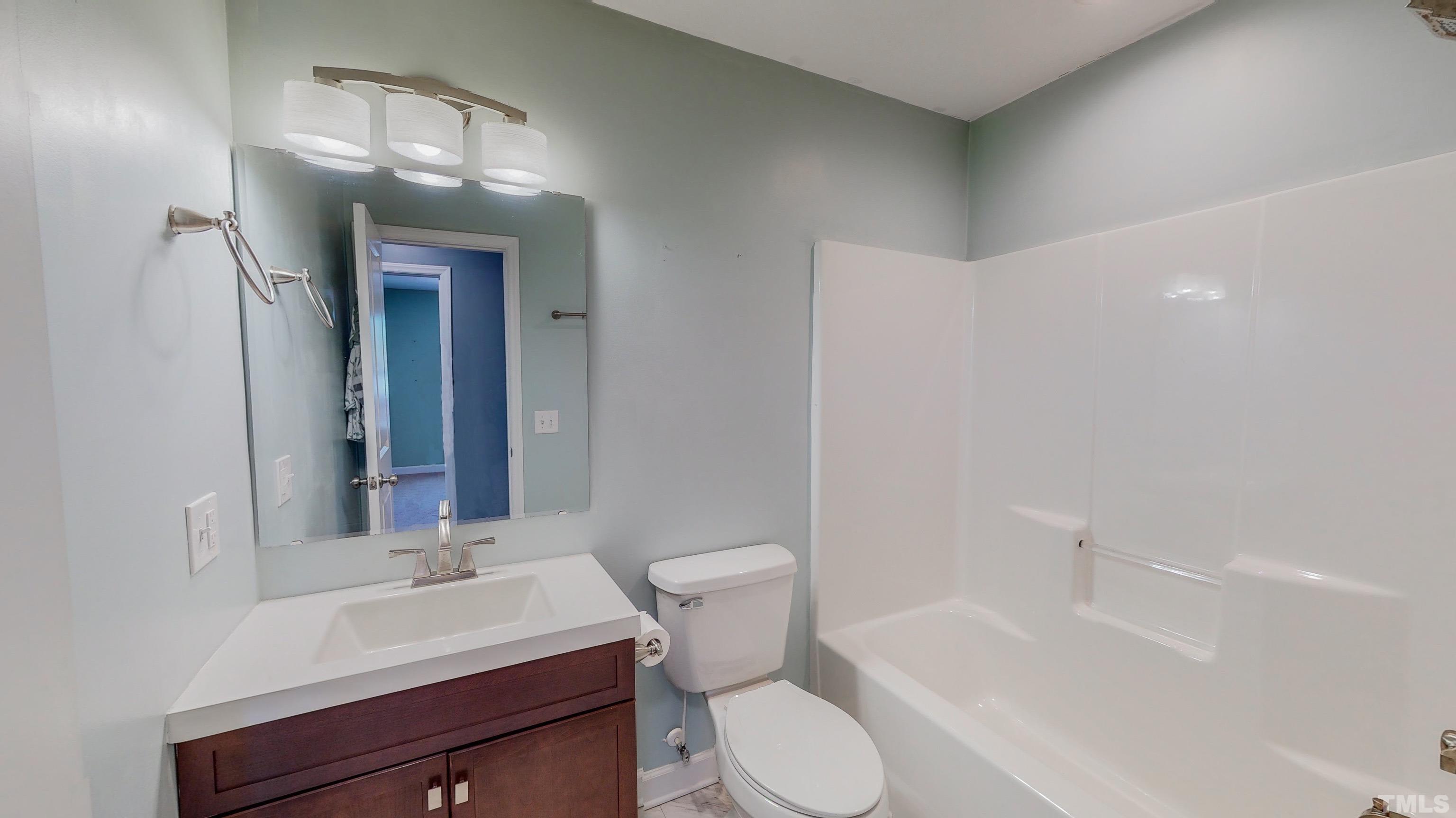 45 Eli Court Roxboro, NC 27573 - Photo 23 of 36 a bathroom with a sink a toilet and shower