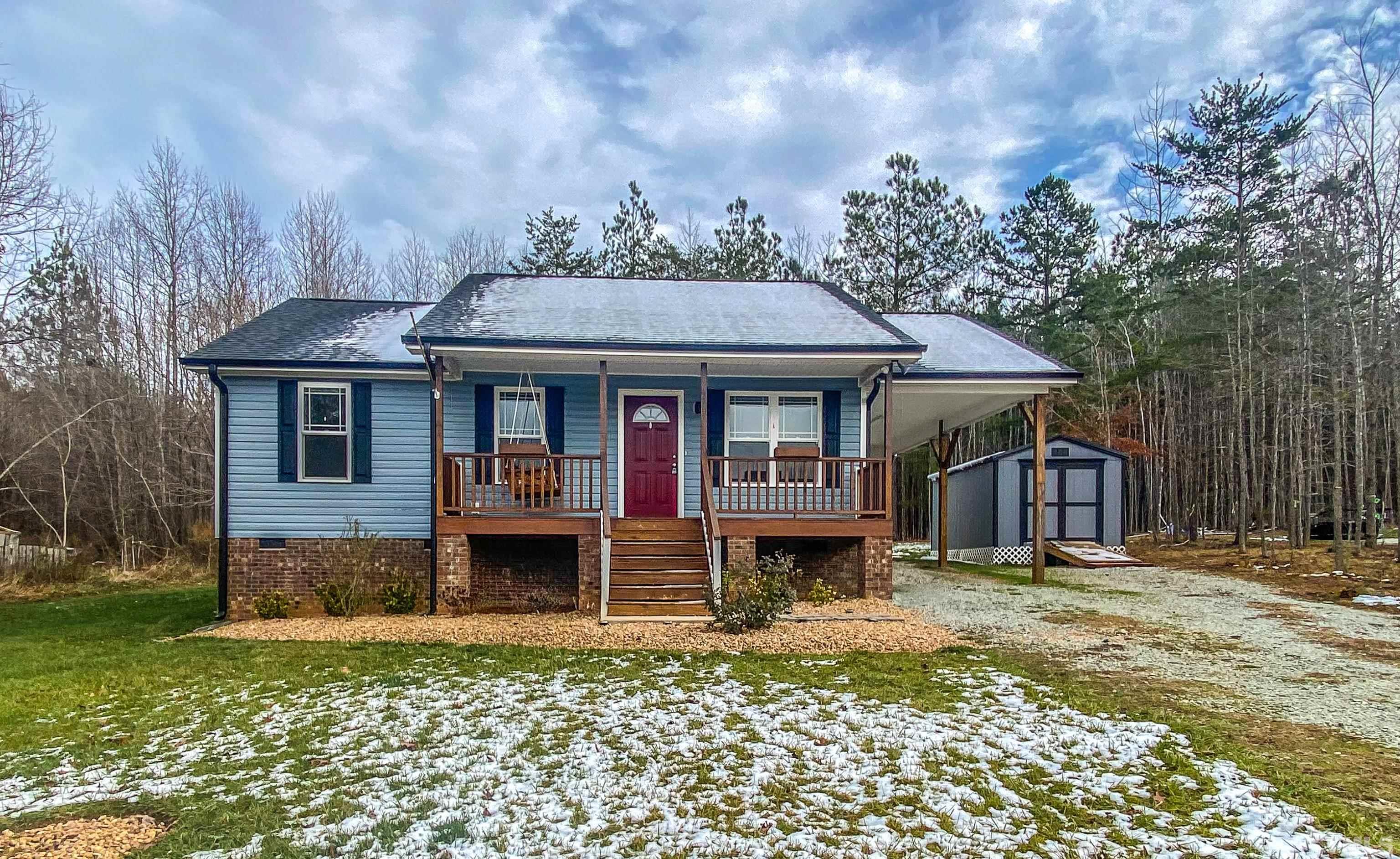 45 Eli Court Roxboro, NC 27573 - Photo 25 of 36 a front view of a house with garden
